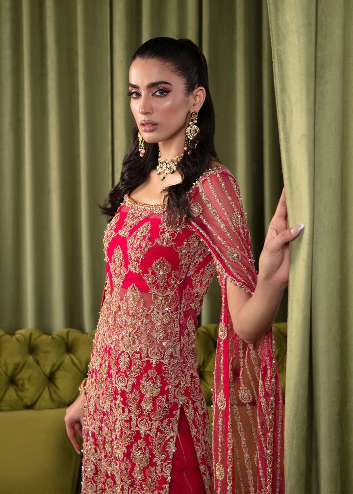 Model wearing Kanwal Malik Elara Luxury Pret '24 Mirage dress in red, showcasing Pakistani wedding clothes online in the UK.