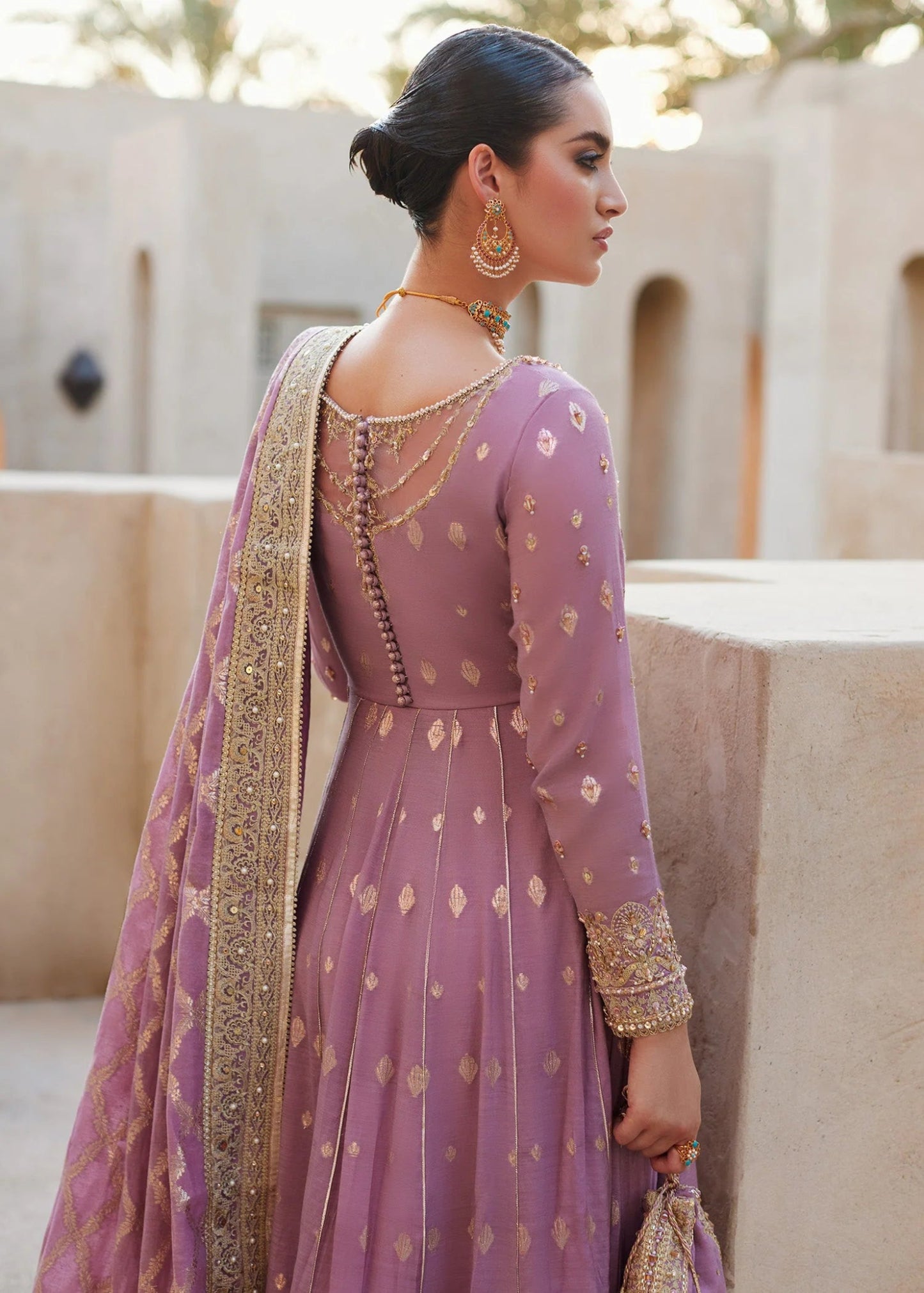 Model wearing Vaneeza from Kanwal Malik's Laira '24, featuring luxurious design. Pakistani clothes online in UK.