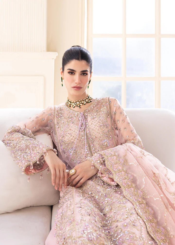 Model wearing Kanwal Malik MIRHA III Eid 24 Orchid dress in pastel pink, enhancing Pakistani wedding clothes online in the UK.