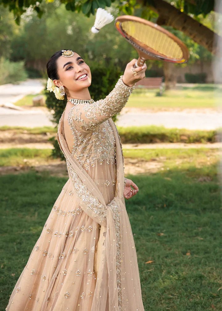 Model wearing Kanwal Malik Raaniyan Luxury Formals Jasmine dress in gold, Pakistani bridal clothes online in UK.