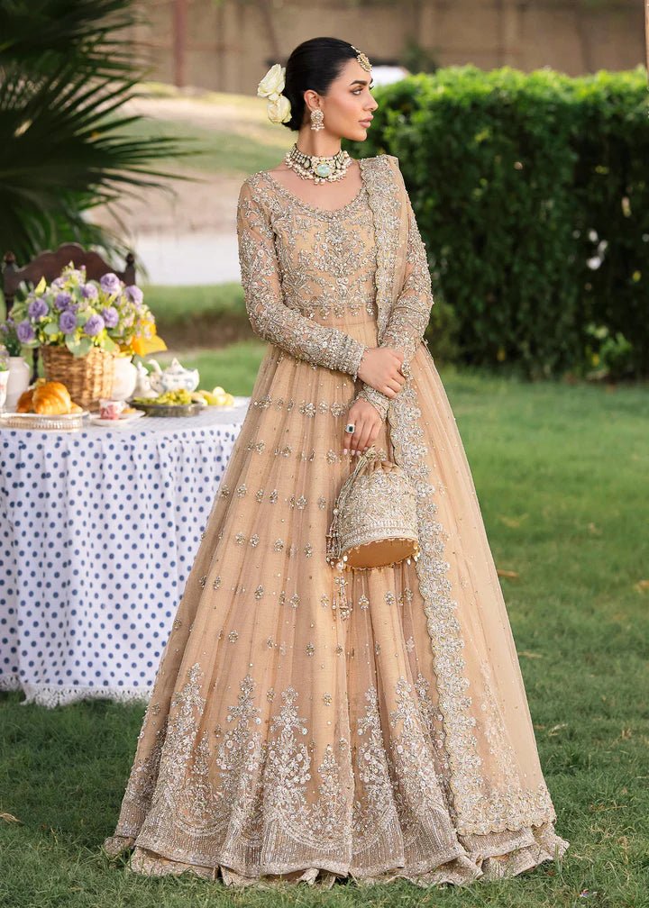 Model wearing Kanwal Malik Raaniyan Luxury Formals Jasmine dress in gold, Pakistani bridal clothes online in UK.