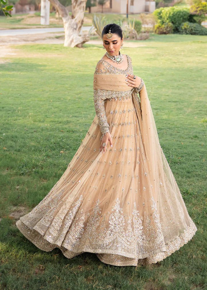Model wearing Kanwal Malik Raaniyan Luxury Formals Jasmine dress in gold, Pakistani bridal clothes online in UK.