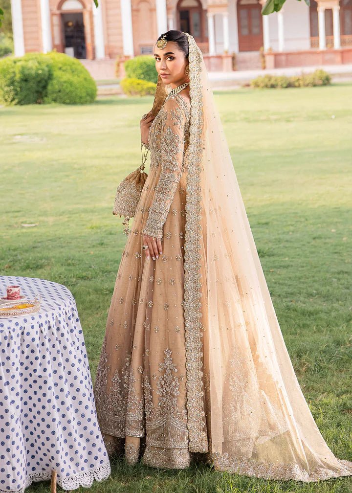Model wearing Kanwal Malik Raaniyan Luxury Formals Jasmine dress in gold, Pakistani bridal clothes online in UK.