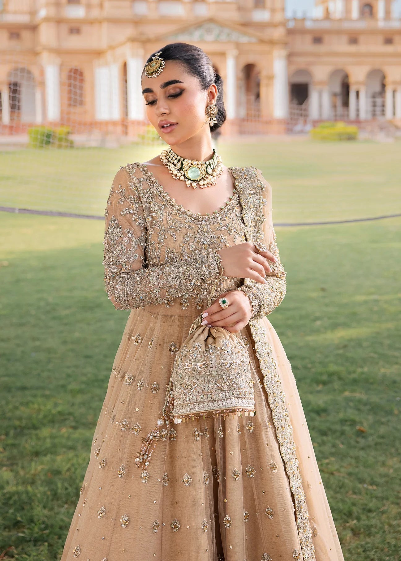 Model wearing Kanwal Malik Raaniyan Luxury Formals Jasmine dress in gold, Pakistani bridal clothes online in UK.