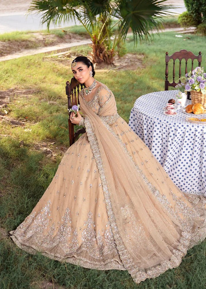 Model wearing Kanwal Malik Raaniyan Luxury Formals Jasmine dress in gold, Pakistani bridal clothes online in UK.