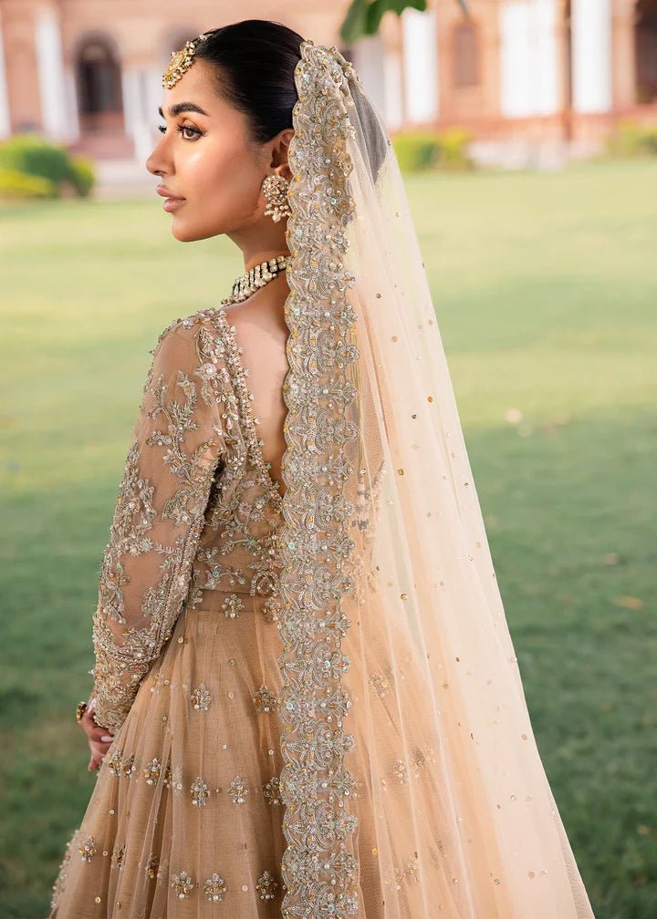 Model wearing Kanwal Malik Raaniyan Luxury Formals Jasmine dress in gold, Pakistani bridal clothes online in UK.