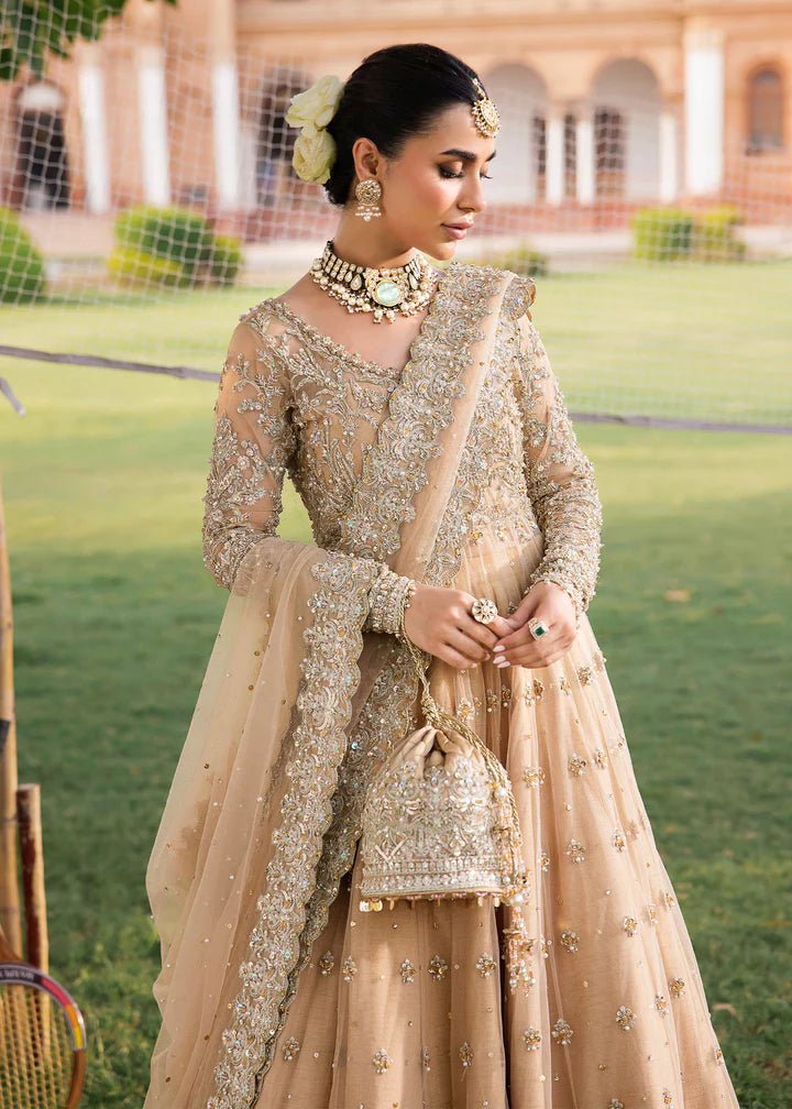 Model wearing Kanwal Malik Raaniyan Luxury Formals Jasmine dress in gold, Pakistani bridal clothes online in UK.