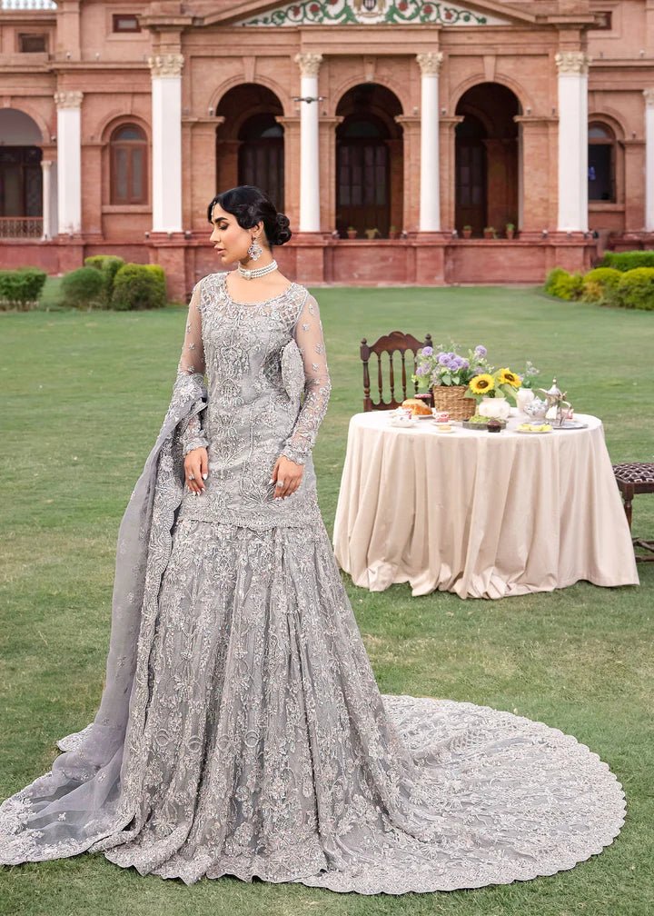 Model wearing Kanwal Malik Raaniyan Luxury Formals Kehkashan dress in silver, Pakistani bridal clothes online in UK.