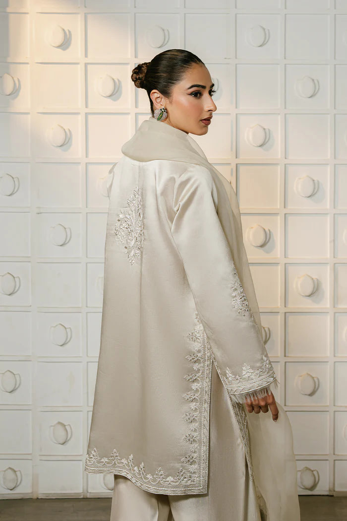 Model wearing ivory ELIYA-SREP1-01 from Saira Rizwan Luxury Lawn Eid Edit '25, perfect Pakistani luxury pret for UK desi fashion lovers.