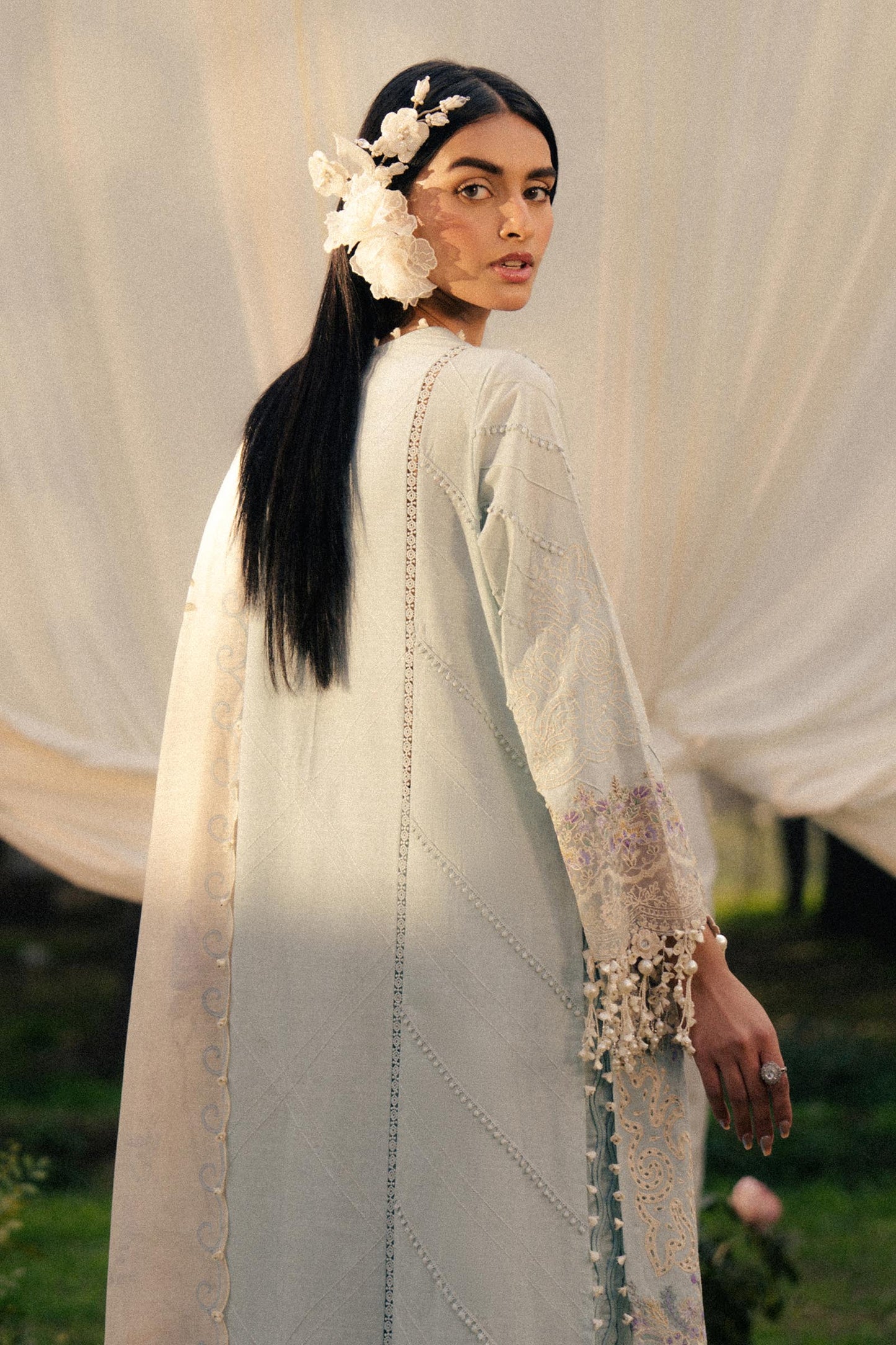 Model wearing pastel blue and ivory embroidered outfit from Sana Safinaz, Luxury Lawn '25, ideal for Pakistani clothes online in UK.