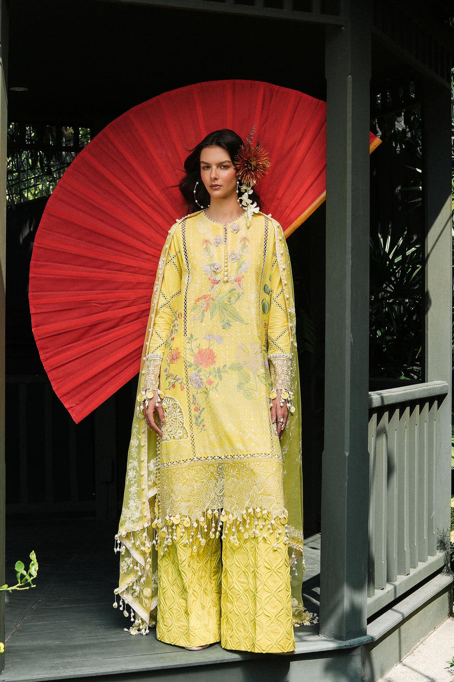 Model wearing lemon yellow embroidered outfit from Sana Safinaz, Luxury Lawn '25, ideal for Pakistani clothes online in UK and luxury pret.