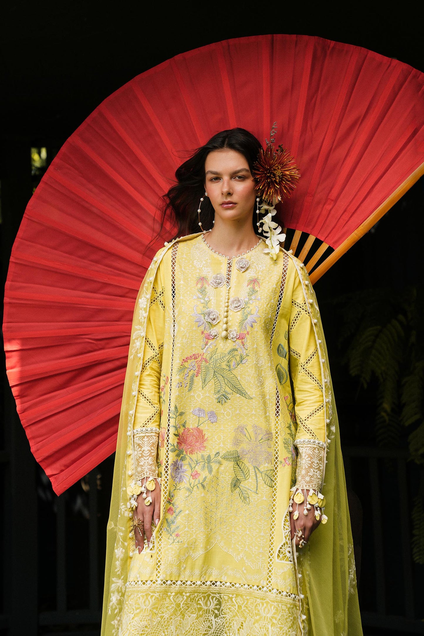 Model wearing lemon yellow embroidered outfit from Sana Safinaz, Luxury Lawn '25, ideal for Pakistani clothes online in UK and luxury pret.