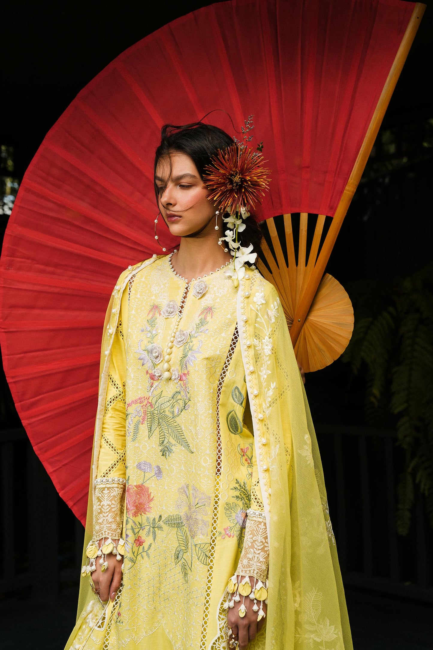 Model wearing lemon yellow embroidered outfit from Sana Safinaz, Luxury Lawn '25, ideal for Pakistani clothes online in UK and luxury pret.