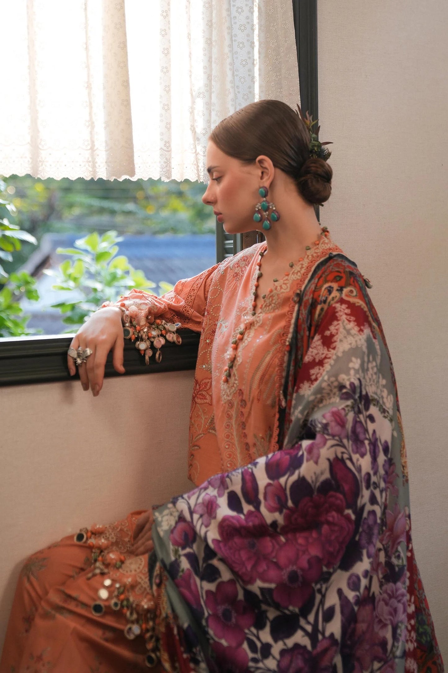 Model wearing peach embroidered dress with multicolour printed dupatta from Sana Safinaz Luxury Lawn '25, Pakistani clothes online in UK.