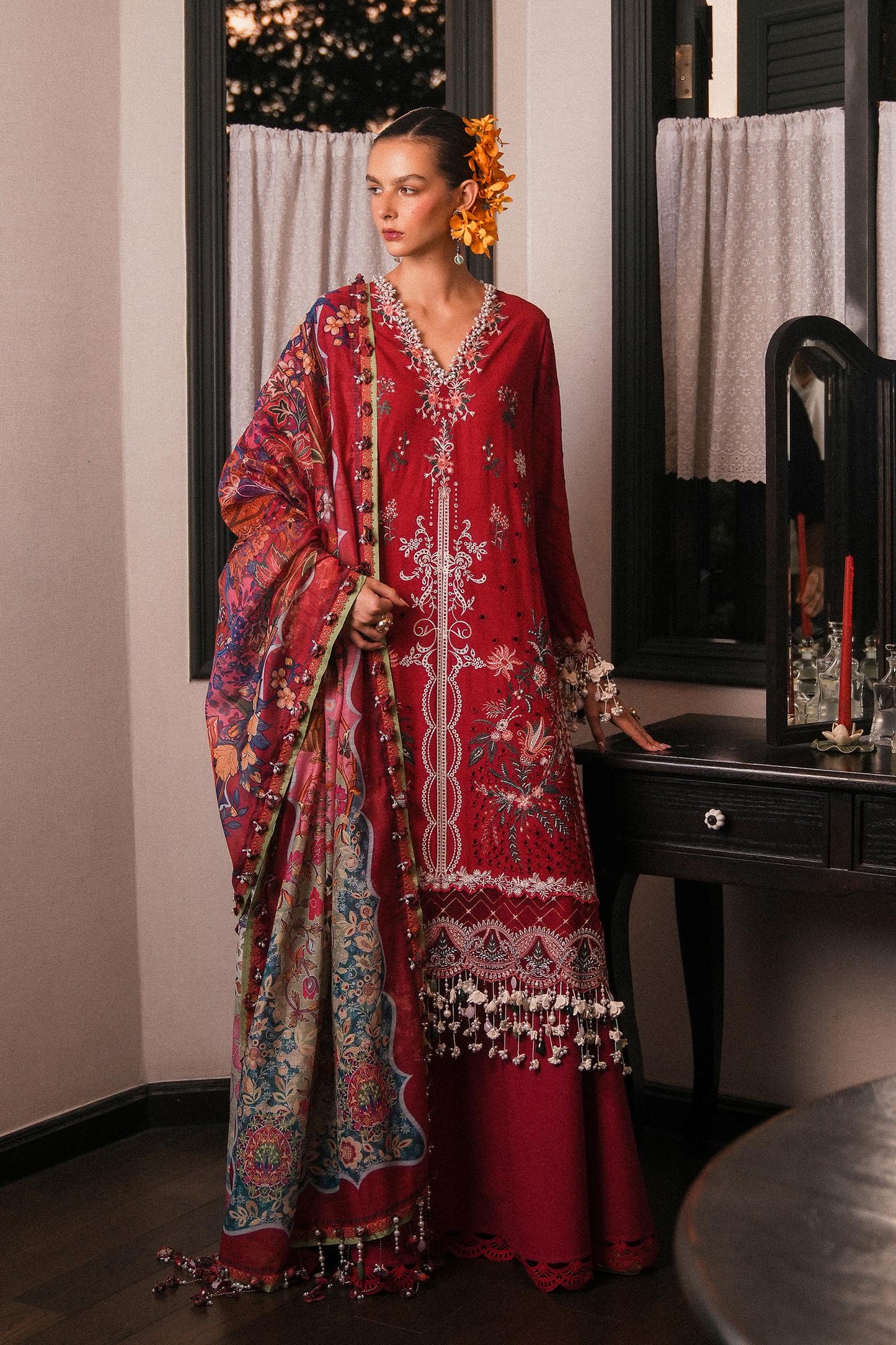 Model wearing deep red embroidered dress with multicolor dupatta from Sana Safinaz Luxury Lawn '25, Pakistani clothes online in UK.