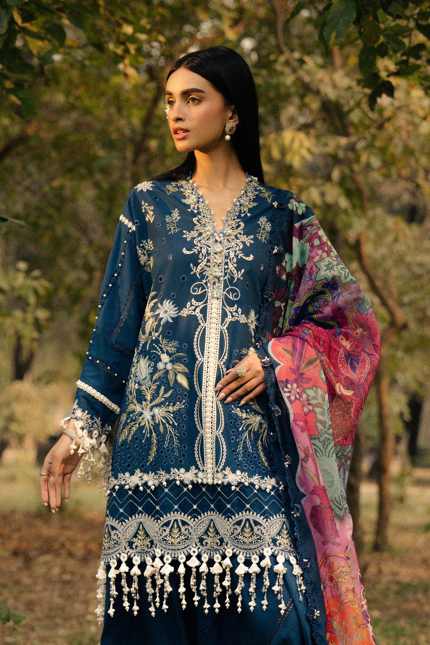 Model wearing navy blue embroidered dress with multicolor dupatta from Sana Safinaz Luxury Lawn '25, Pakistani clothes online in UK.
