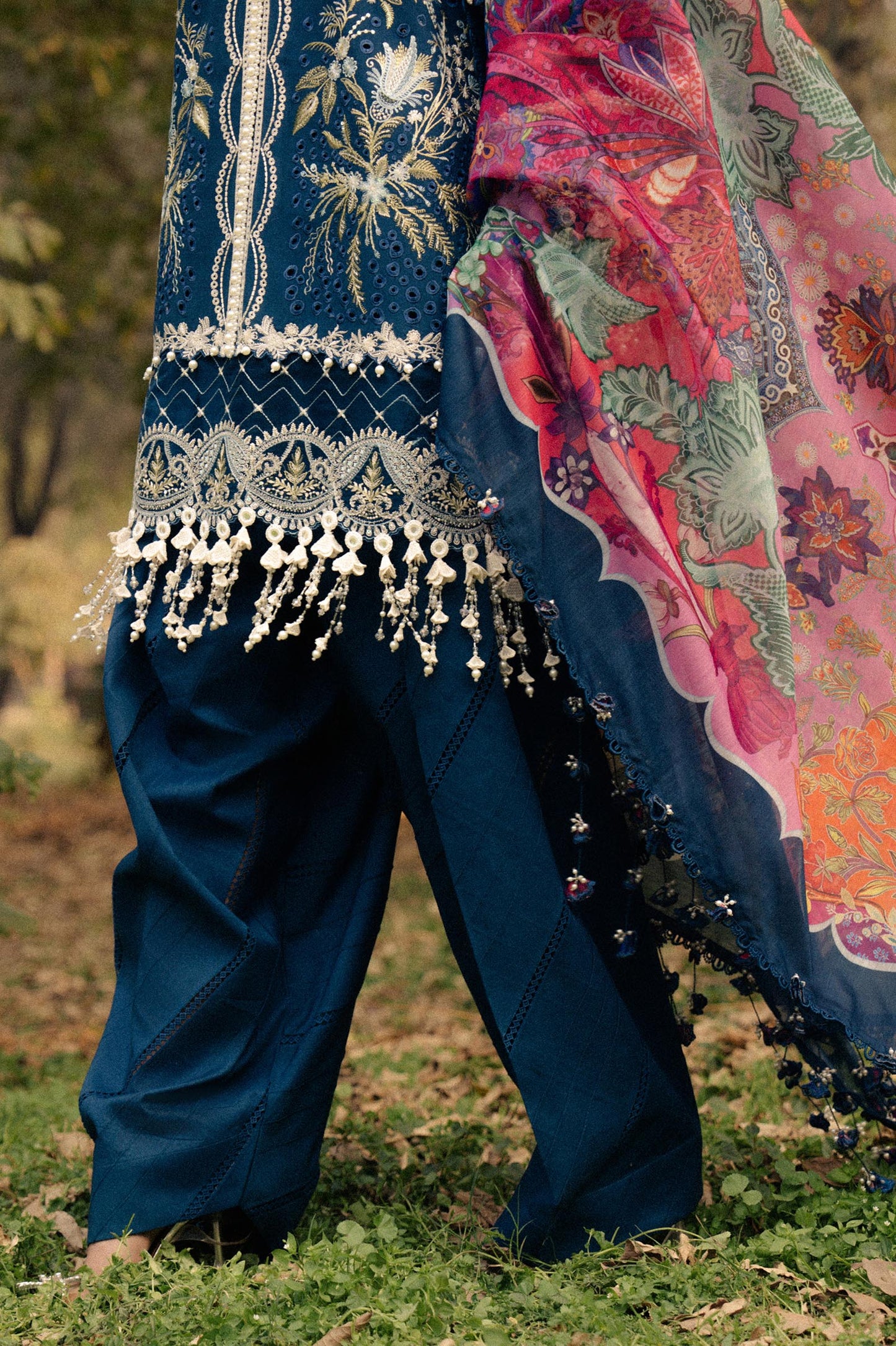Model wearing navy blue embroidered dress with multicolor dupatta from Sana Safinaz Luxury Lawn '25, Pakistani clothes online in UK.
