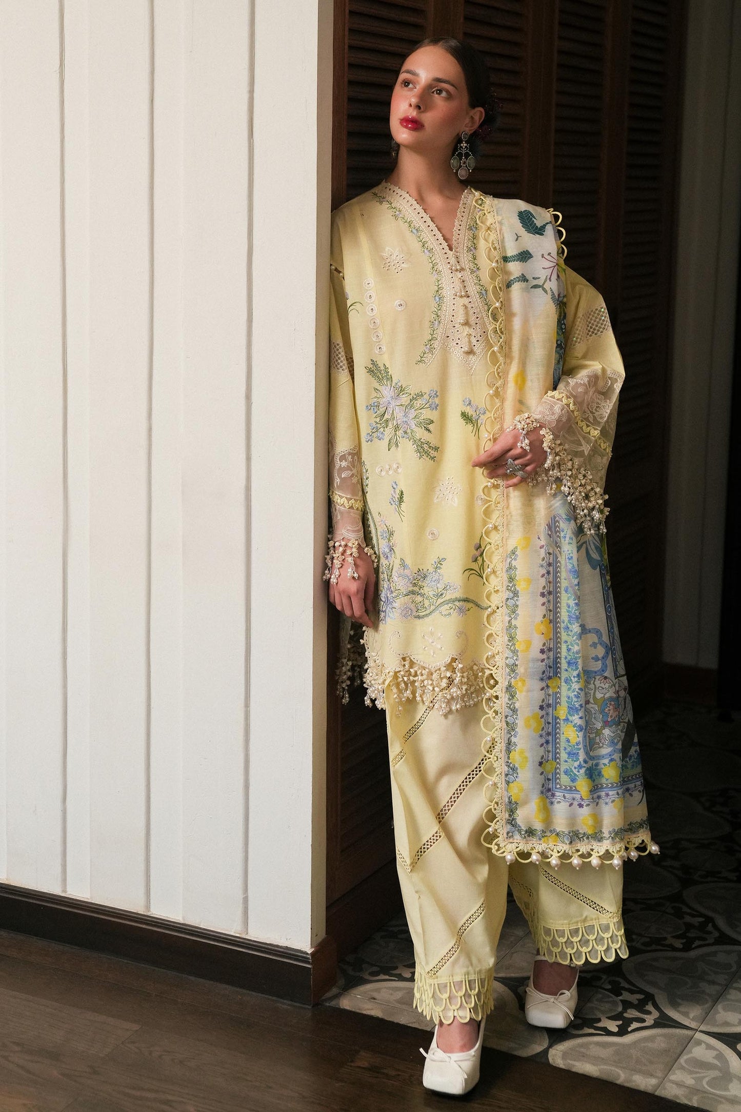 Model wearing lemon yellow embroidered dress with printed dupatta from Sana Safinaz Luxury Lawn '25, Pakistani clothes online in UK.