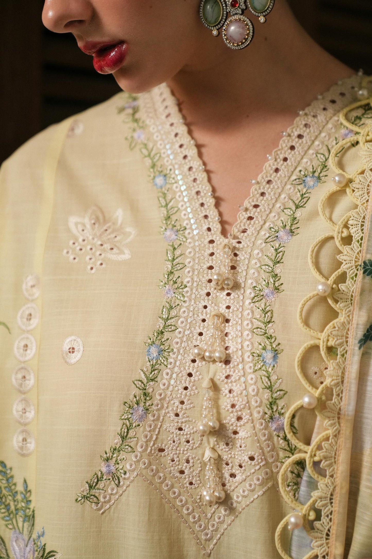 Model wearing lemon yellow embroidered dress with printed dupatta from Sana Safinaz Luxury Lawn '25, Pakistani clothes online in UK.