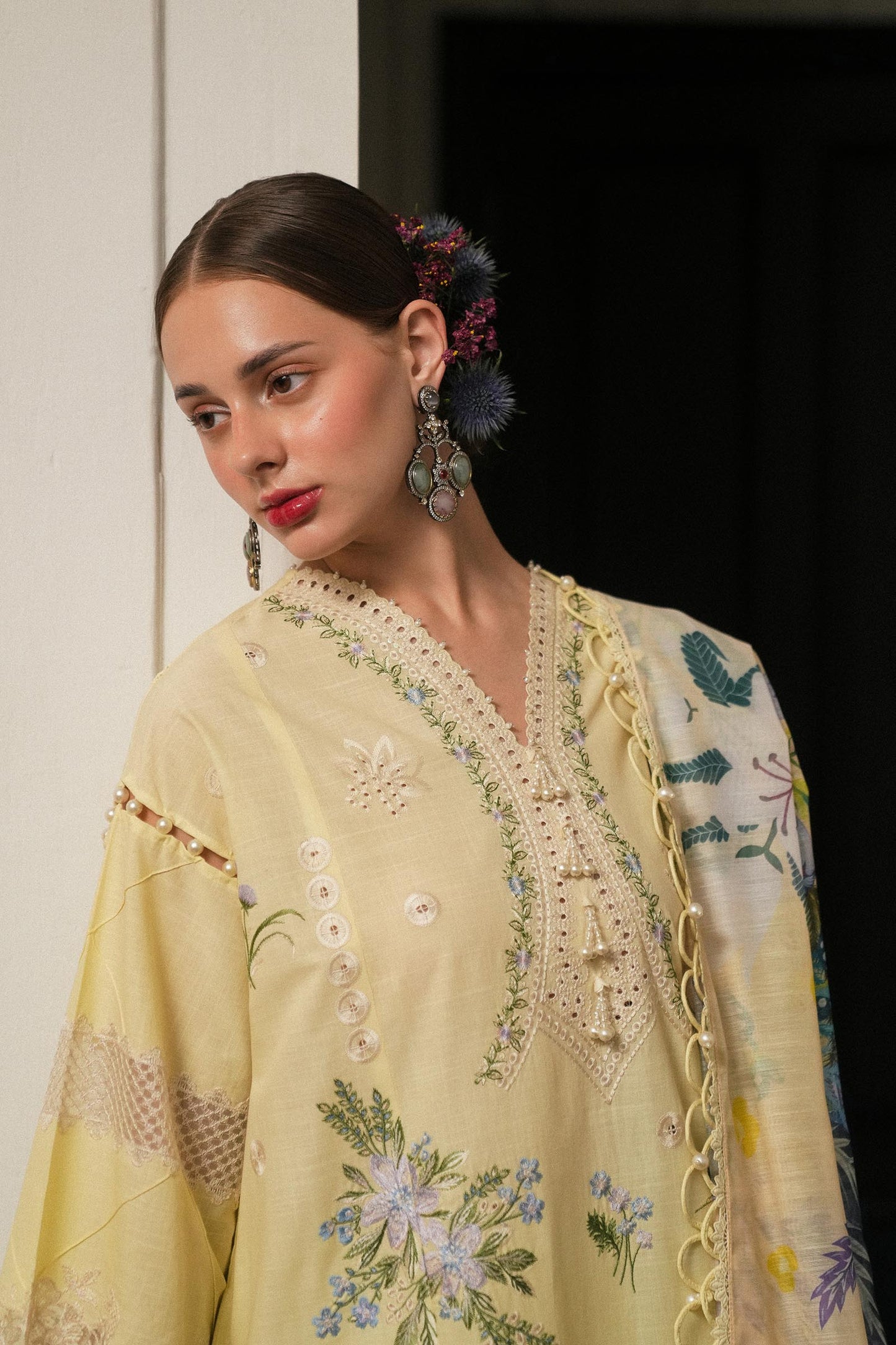 Model wearing lemon yellow embroidered dress with printed dupatta from Sana Safinaz Luxury Lawn '25, Pakistani clothes online in UK.