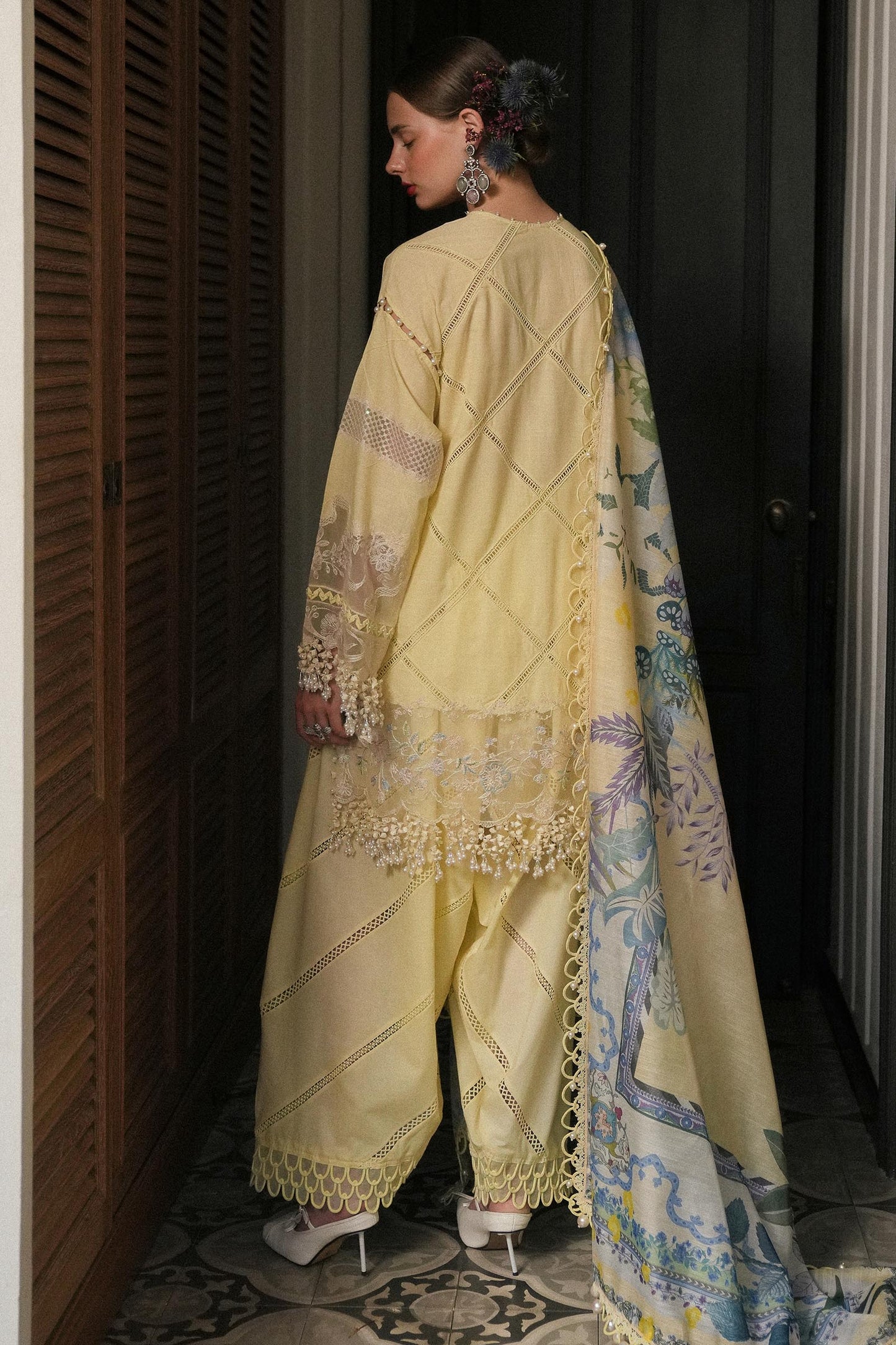 Model wearing lemon yellow embroidered dress with printed dupatta from Sana Safinaz Luxury Lawn '25, Pakistani clothes online in UK.