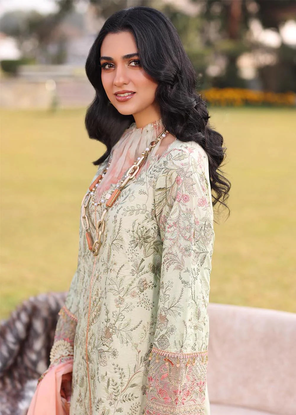 Model wearing light green and peach printed dress with floral dupatta from Musferah Saad Pretty Girls Luxury Lawn '25 Lilia, Pakistani clothes online in UK.