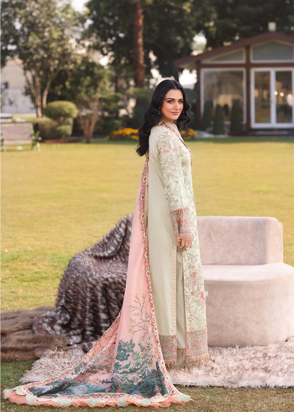 Model wearing light green and peach printed dress with floral dupatta from Musferah Saad Pretty Girls Luxury Lawn '25 Lilia, Pakistani clothes online in UK.