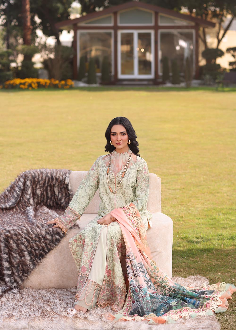 Model wearing light green and peach printed dress with floral dupatta from Musferah Saad Pretty Girls Luxury Lawn '25 Lilia, Pakistani clothes online in UK.