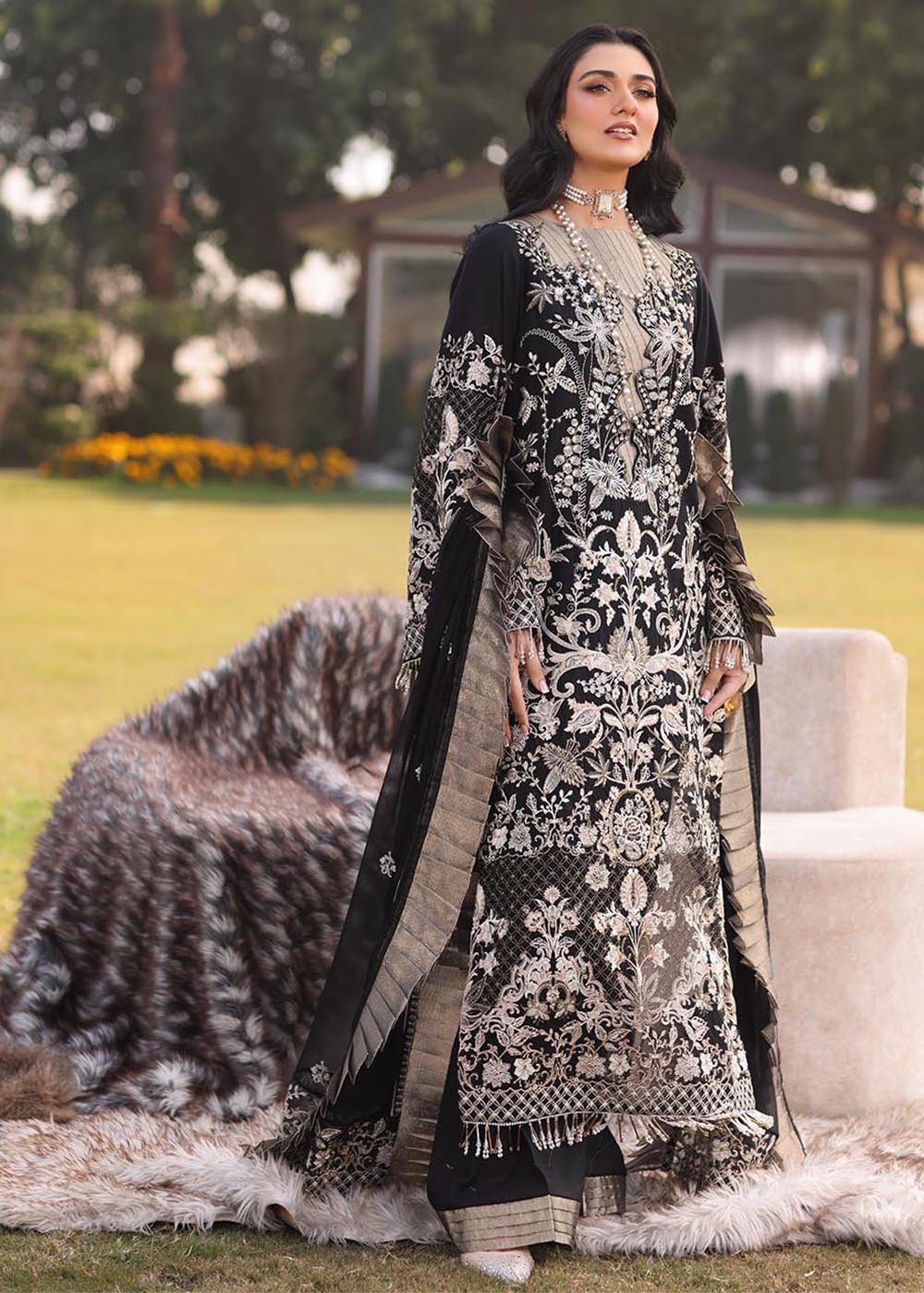 Model wearing black and gold embroidered dress with matching dupatta from Musferah Saad Pretty Girls Luxury Lawn 2025 Lustre. Pakistani clothes online UK.