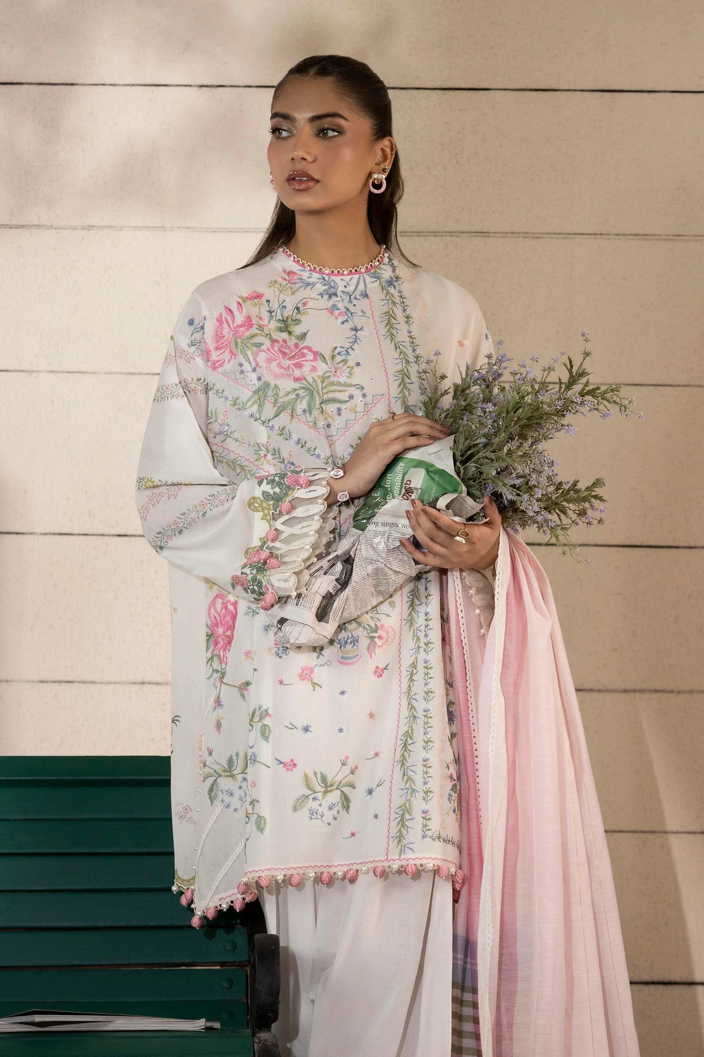 Model wearing ivory and pastel floral printed dress with striped pink dupatta from Sana Safinaz Muzlin Spring '25, Pakistani clothes online in UK.