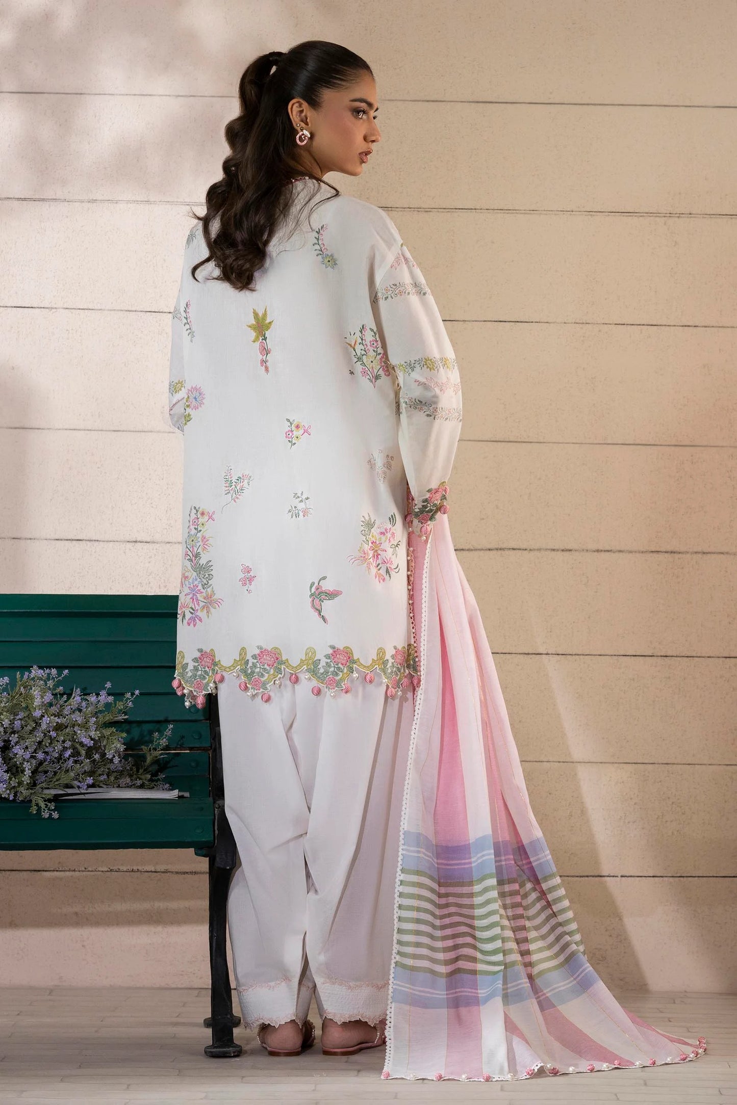 Model wearing ivory and pastel floral printed dress with striped pink dupatta from Sana Safinaz Muzlin Spring '25, Pakistani clothes online in UK.