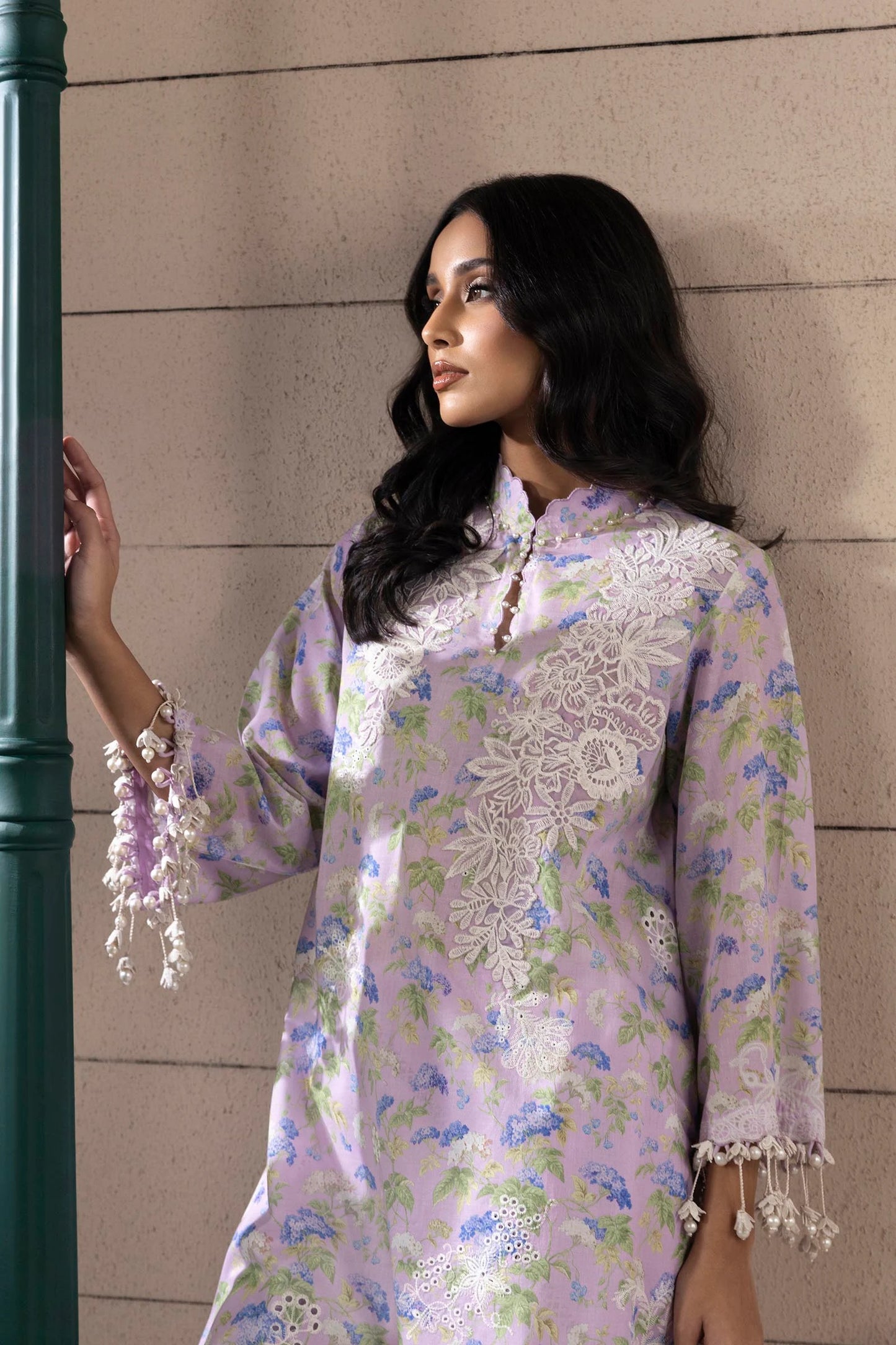 Model wearing lilac floral printed dress with white embroidery from Sana Safinaz Muzlin Spring '25, Pakistani Luxury pret online UK.