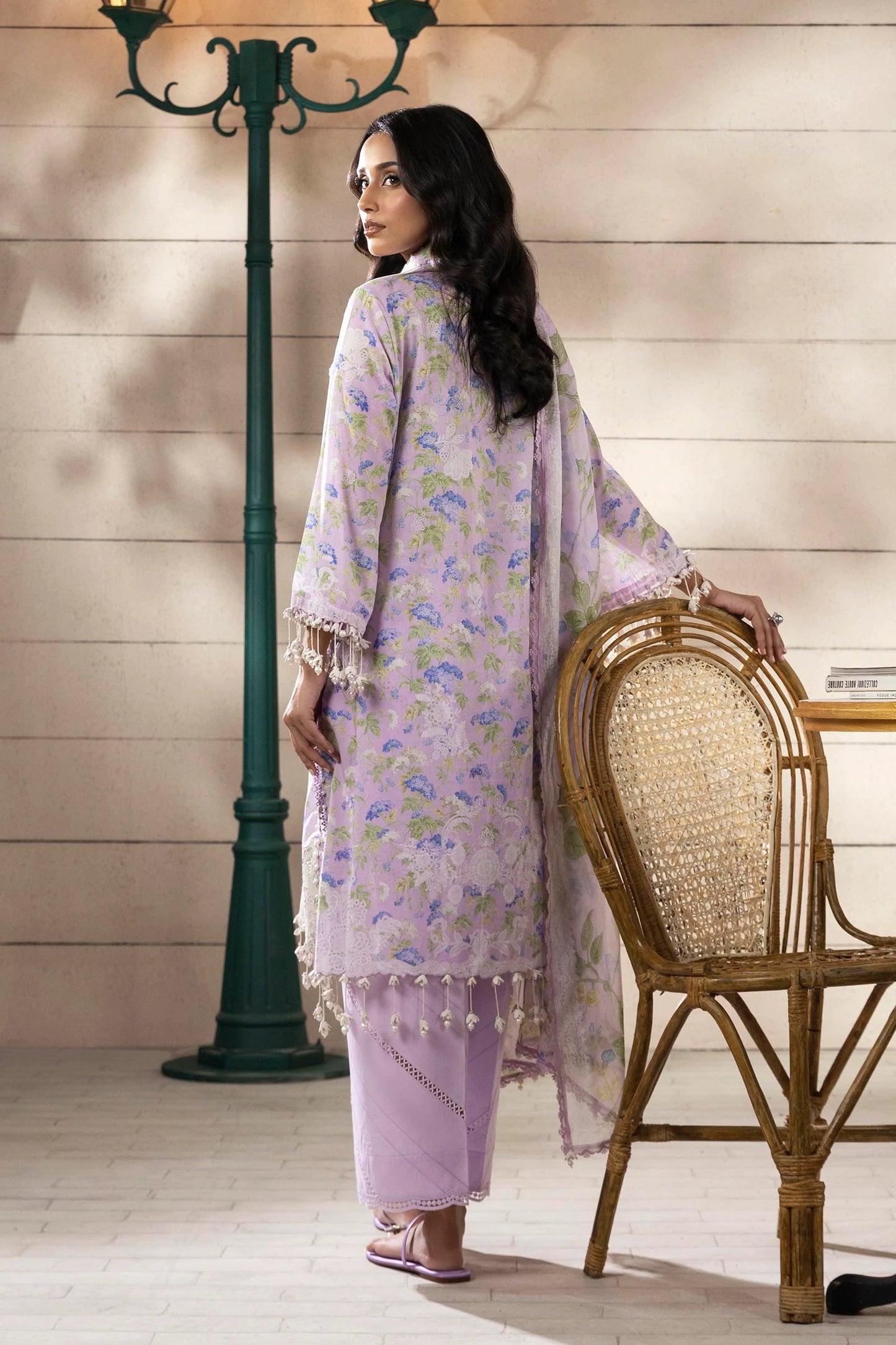 Model wearing lilac floral printed dress with white embroidery from Sana Safinaz Muzlin Spring '25, Pakistani Luxury pret online UK.