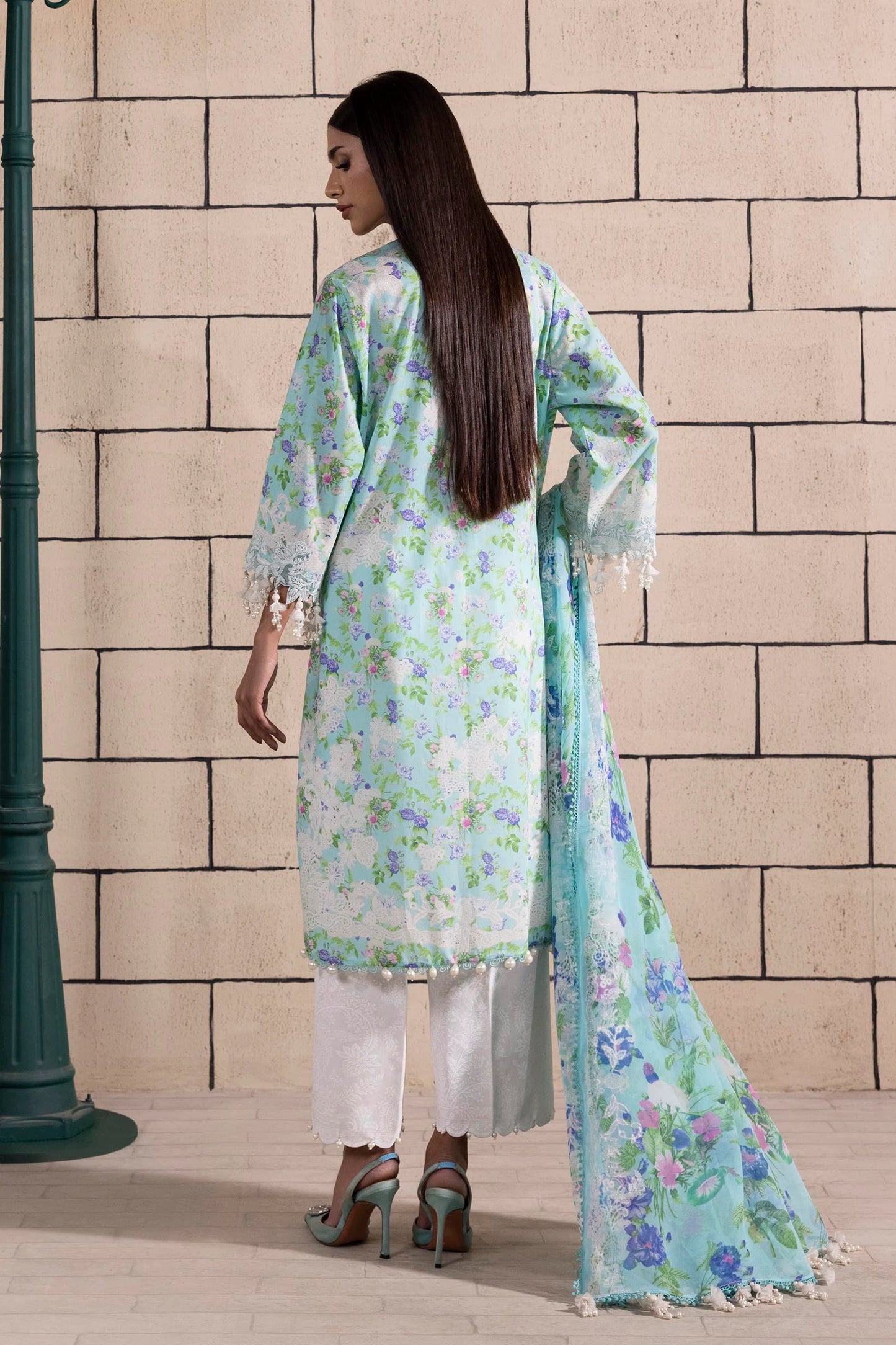 Model wearing aqua blue floral print dress with lace details and chiffon dupatta from Sana Safinaz Muzlin Spring '25, Pakistani Luxury pret UK.