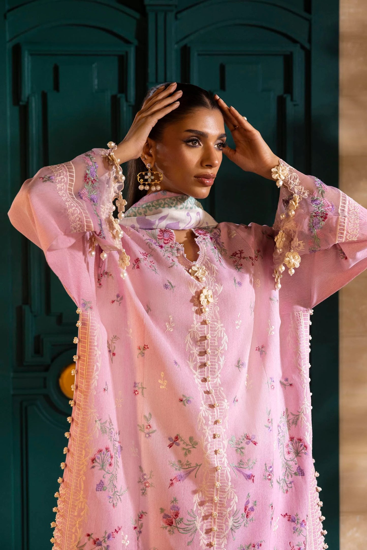 Model wearing pastel pink embroidered outfit with floral printed dupatta from Sana Safinaz Muzlin Spring '25, Pakistani Luxury pret UK.