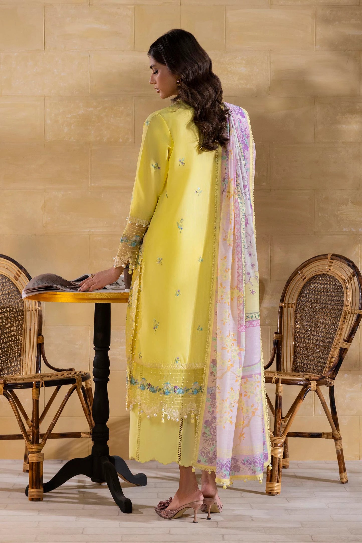 Model wearing lemon yellow embroidered outfit with pastel dupatta from Sana Safinaz Muzlin Spring '25, Pakistani Luxury pret in UK.