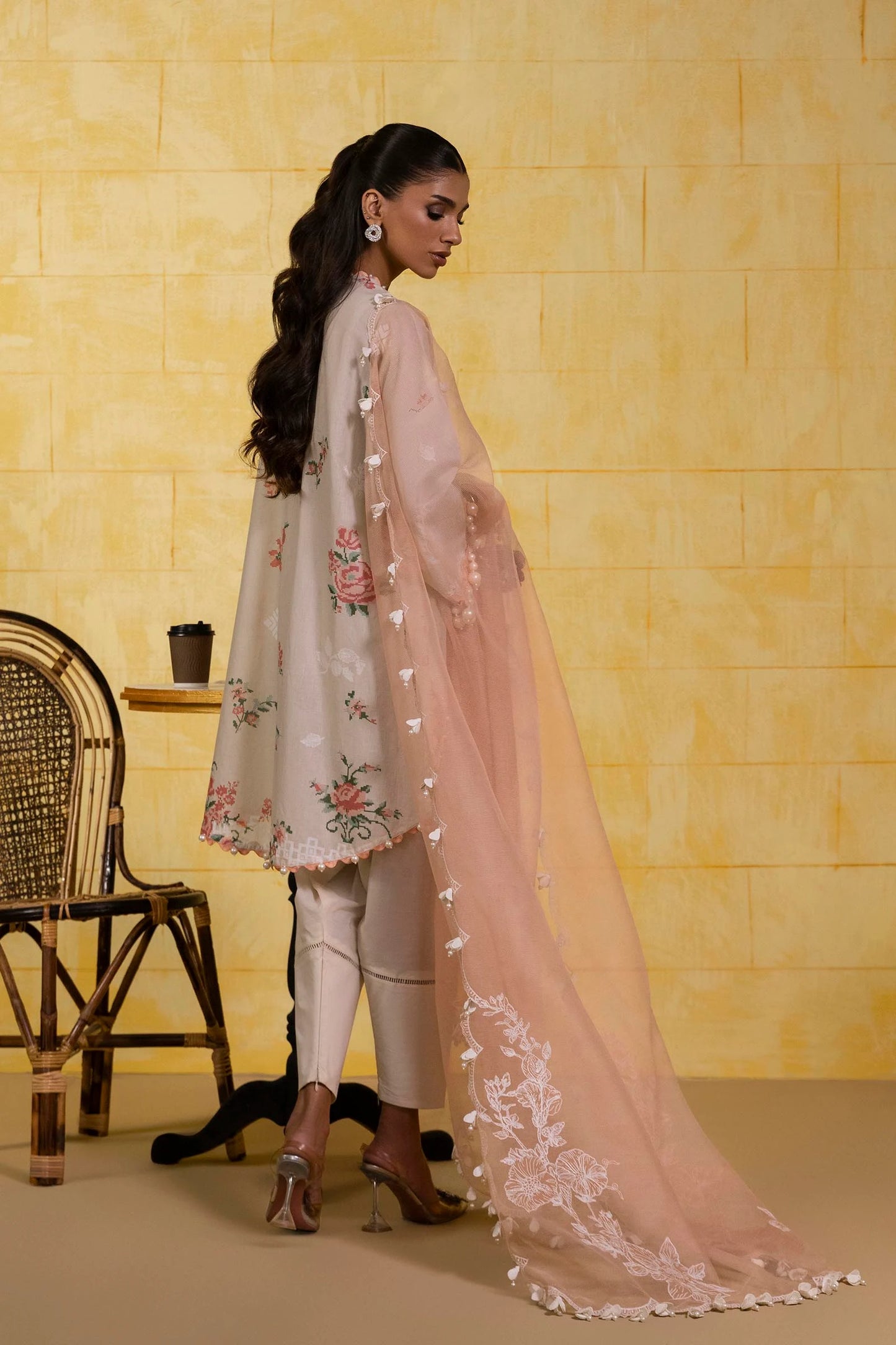 Model wearing peach beige Sana Safinaz M251-016A-3CT outfit with floral embroidery and peach organza dupatta, Pakistani Luxury pret in UK.