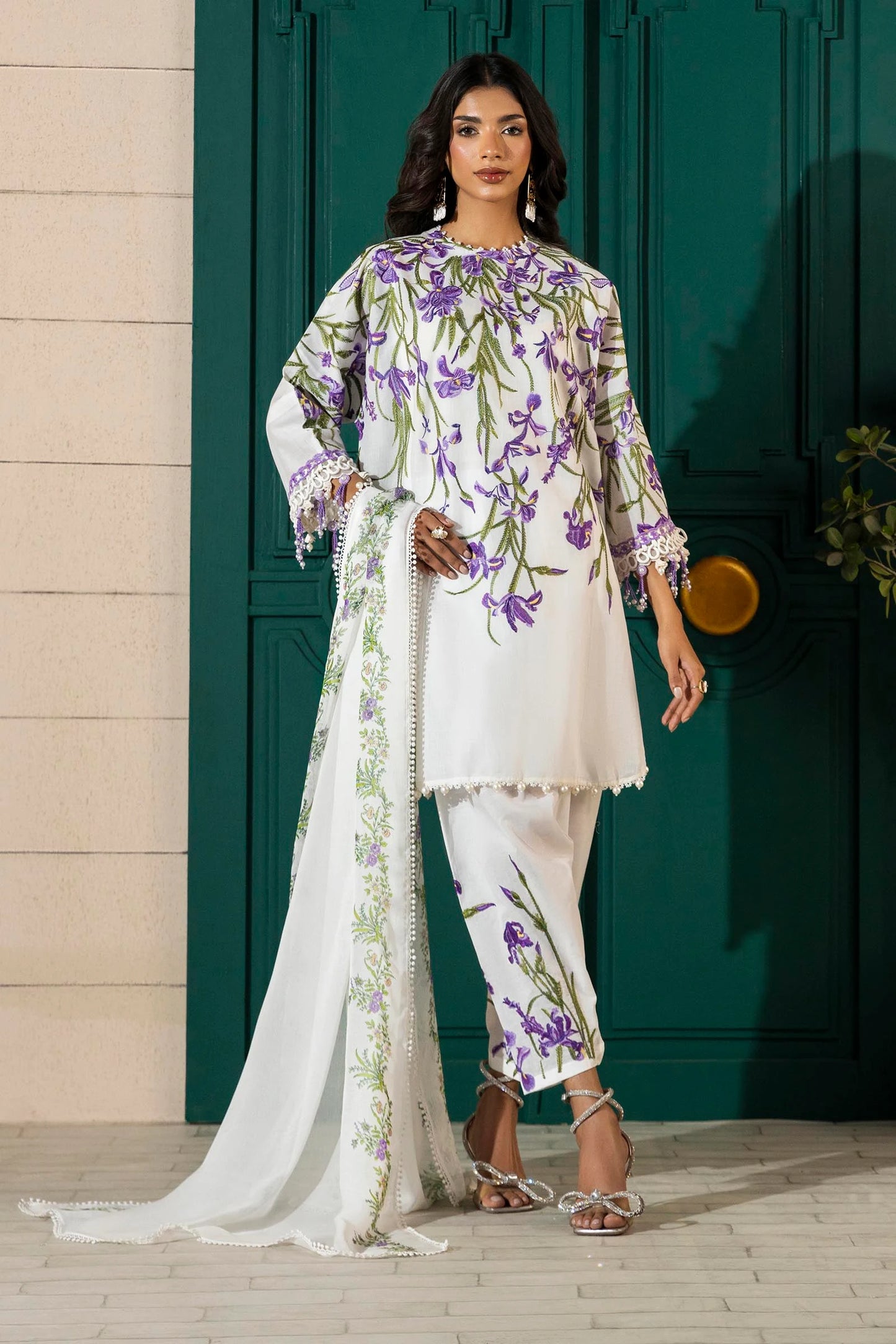 Model wearing white Sana Safinaz M251-017A-3CJ outfit with purple floral embroidery and printed dupatta, Pakistani Luxury pret in UK.