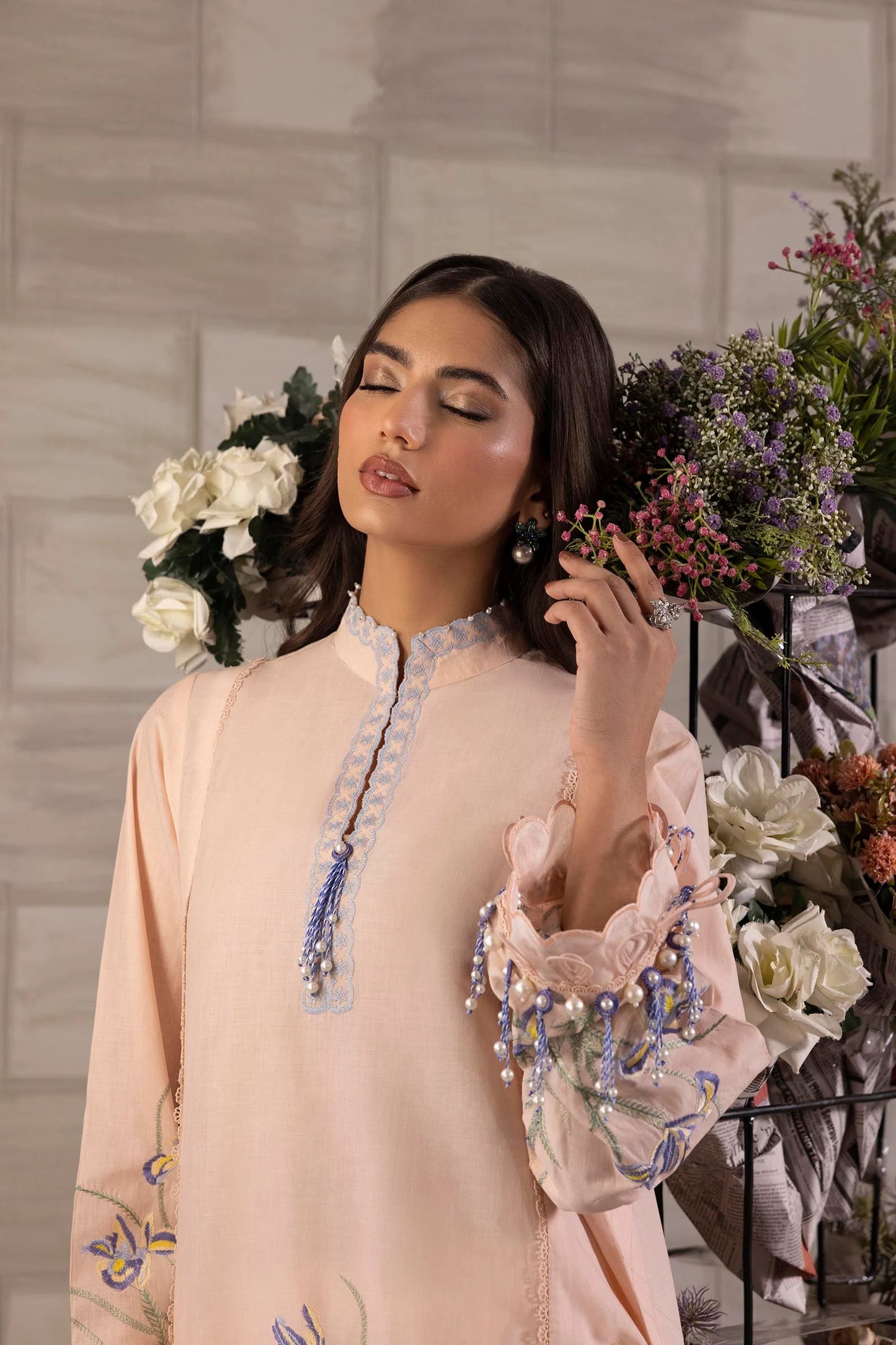 Model wearing peach Sana Safinaz M251-017B-3CJ outfit with blue floral embroidery and matching dupatta, Pakistani Luxury pret in UK.