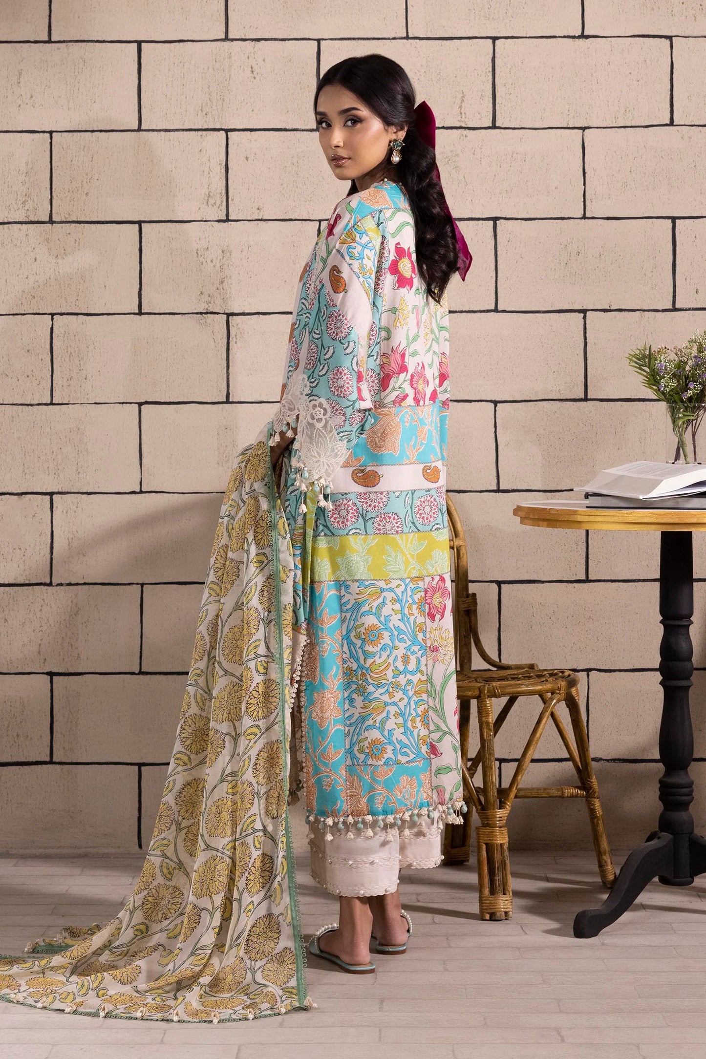 Model wearing multicolor Sana Safinaz M251-027B-3CI outfit with vibrant prints and ivory base, Pakistani Luxury pret, Pakistani clothes online in UK.