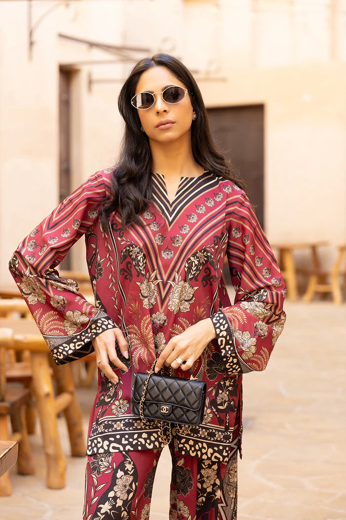 Model wearing maroon co-ord set with beige and black floral print from Saira Rizwan, Pakistani Luxury pret, Pakistani clothes online in UK.