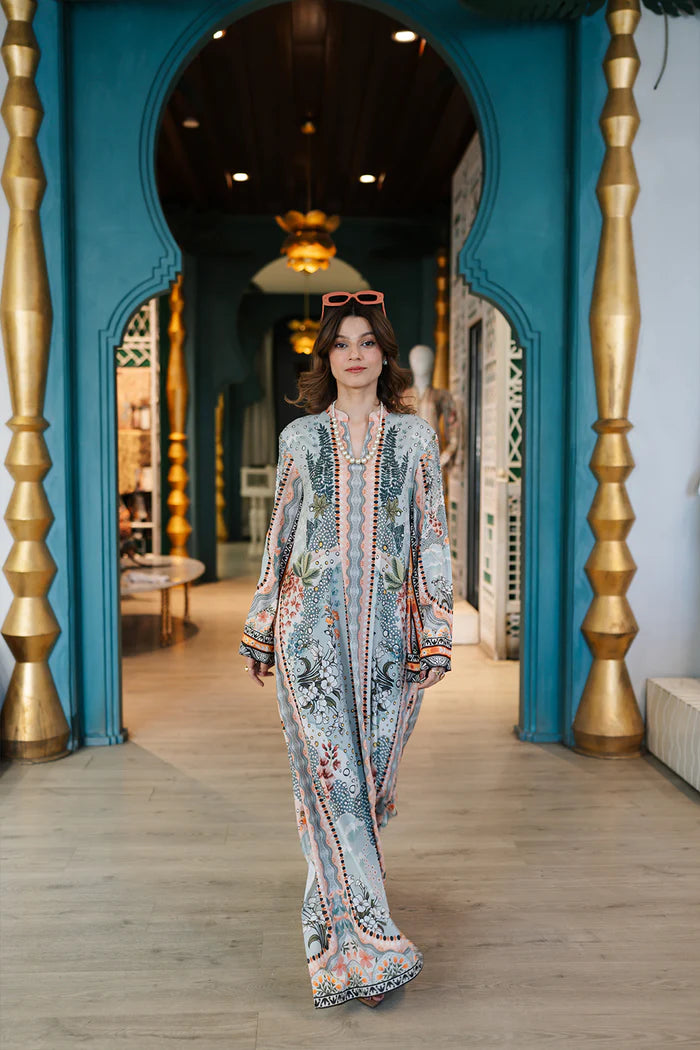 Model wearing multicolour printed long kaftan-style dress with flared sleeves from Saira Rizwan, Pakistani luxury pret, Pakistani clothes online in UK.