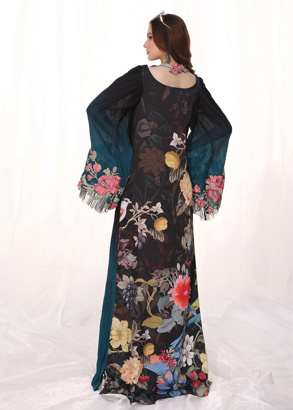 Model wearing ombre black and teal embroidered pleated dress from Musferah Saad Moonlit Glam, Pakistani Luxury pret available online in UK.