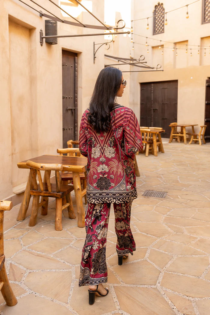 Model wearing maroon co-ord set with beige and black floral print from Saira Rizwan, Pakistani Luxury pret, Pakistani clothes online in UK.