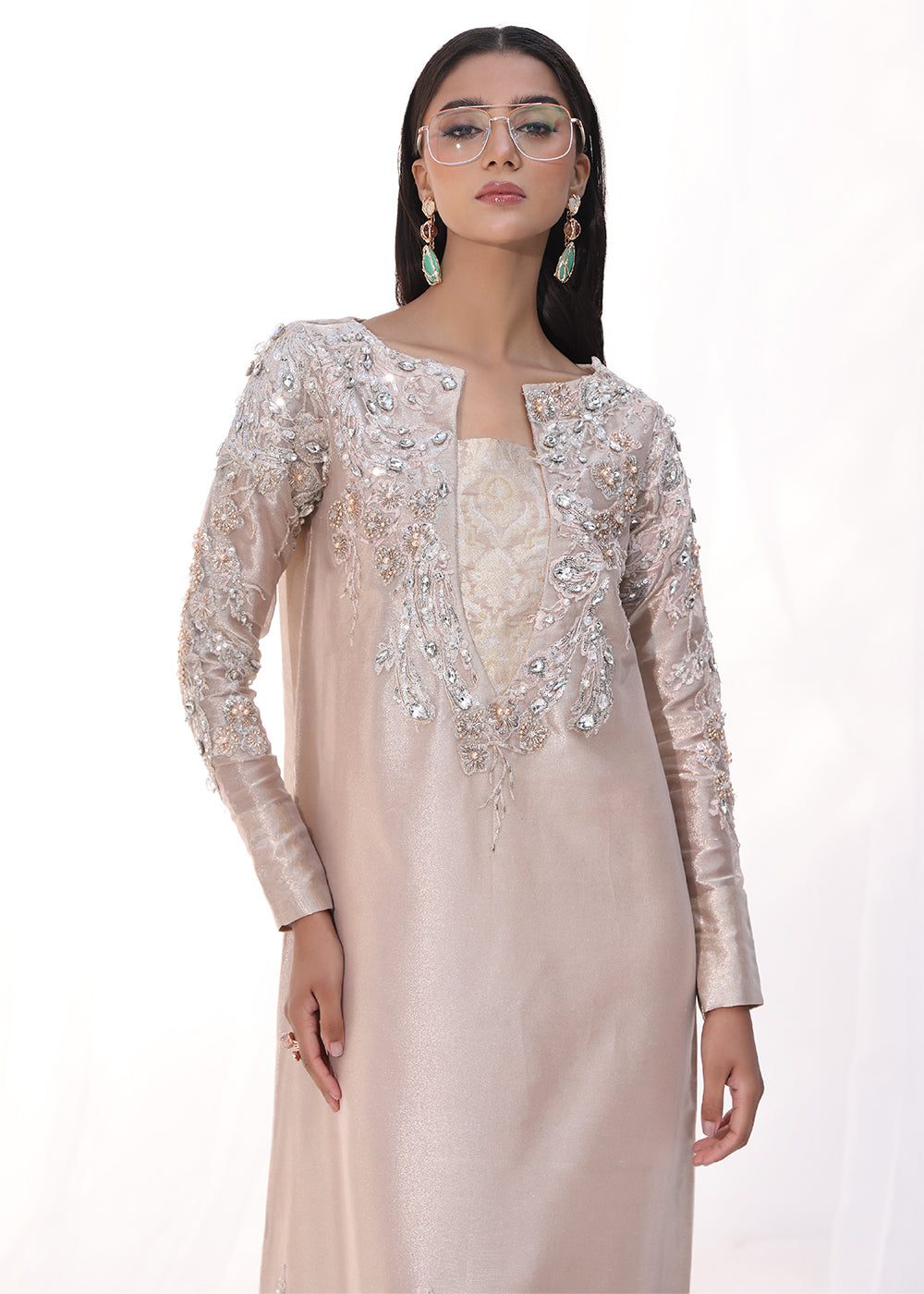 Model wearing blush pink embellished long dress from Musferah Saad Moonlit Rose, Pakistani Luxury pret, Pakistani clothes online in UK.