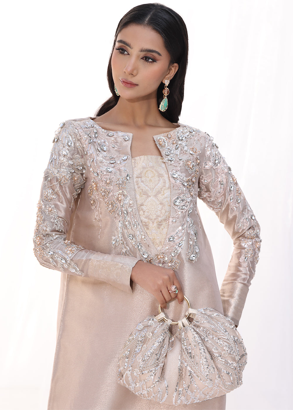 Model wearing blush pink embellished long dress from Musferah Saad Moonlit Rose, Pakistani Luxury pret, Pakistani clothes online in UK.