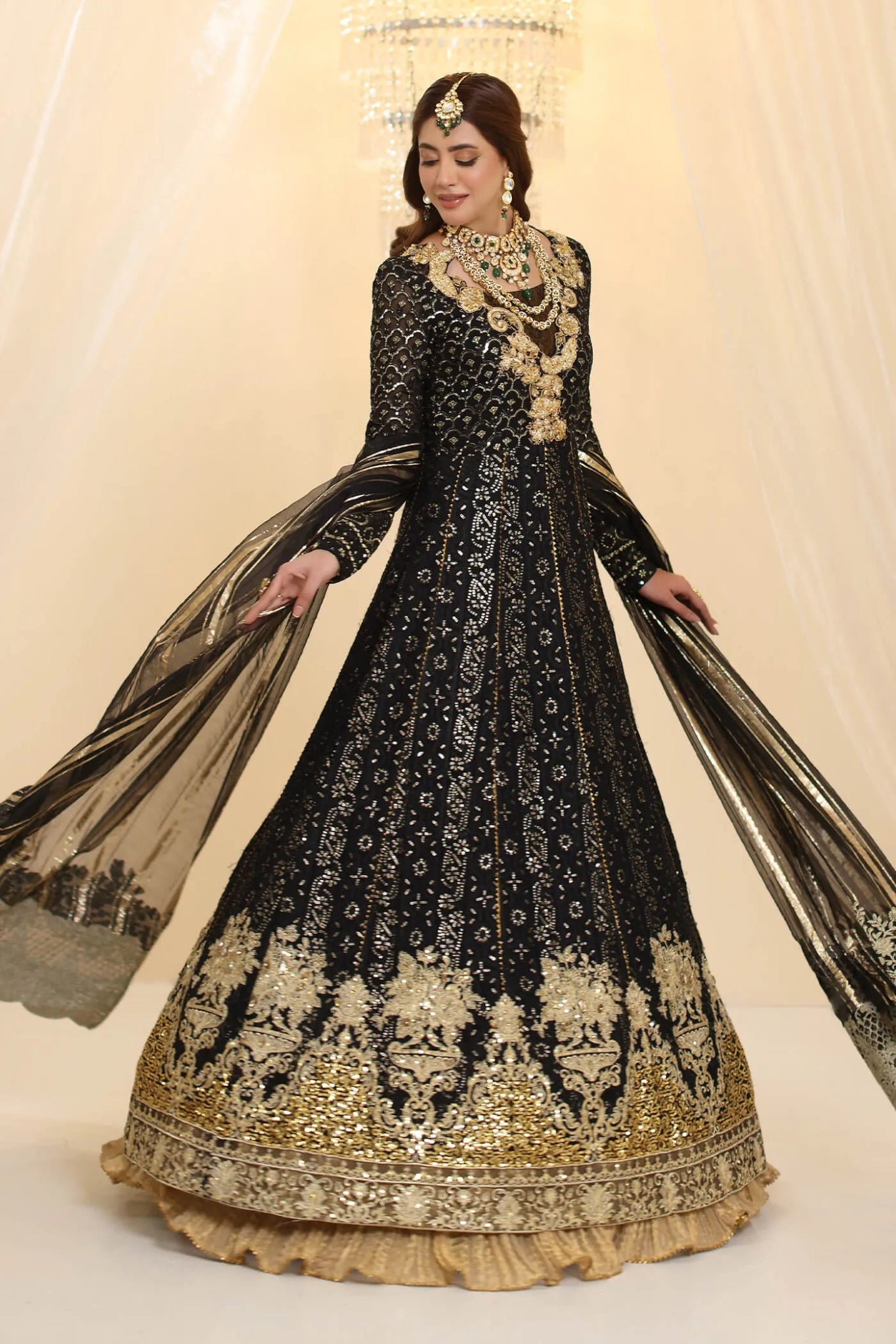 Model wearing Musferah Saad Enchantment dress in black and gold from the Ethereal Dream Formals collection, perfect for Pakistani wedding clothes online in the UK.