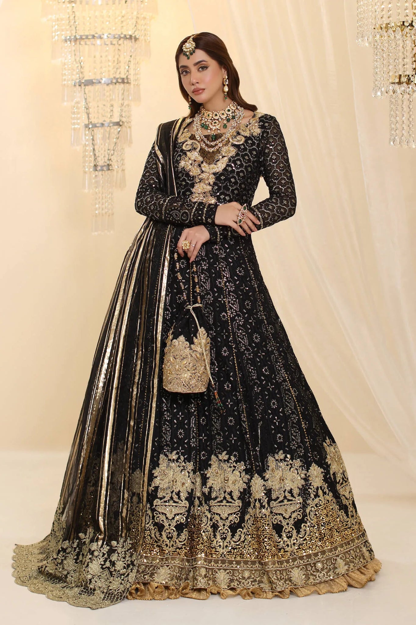 Model wearing Musferah Saad Enchantment dress in black and gold from the Ethereal Dream Formals collection, perfect for Pakistani wedding clothes online in the UK.