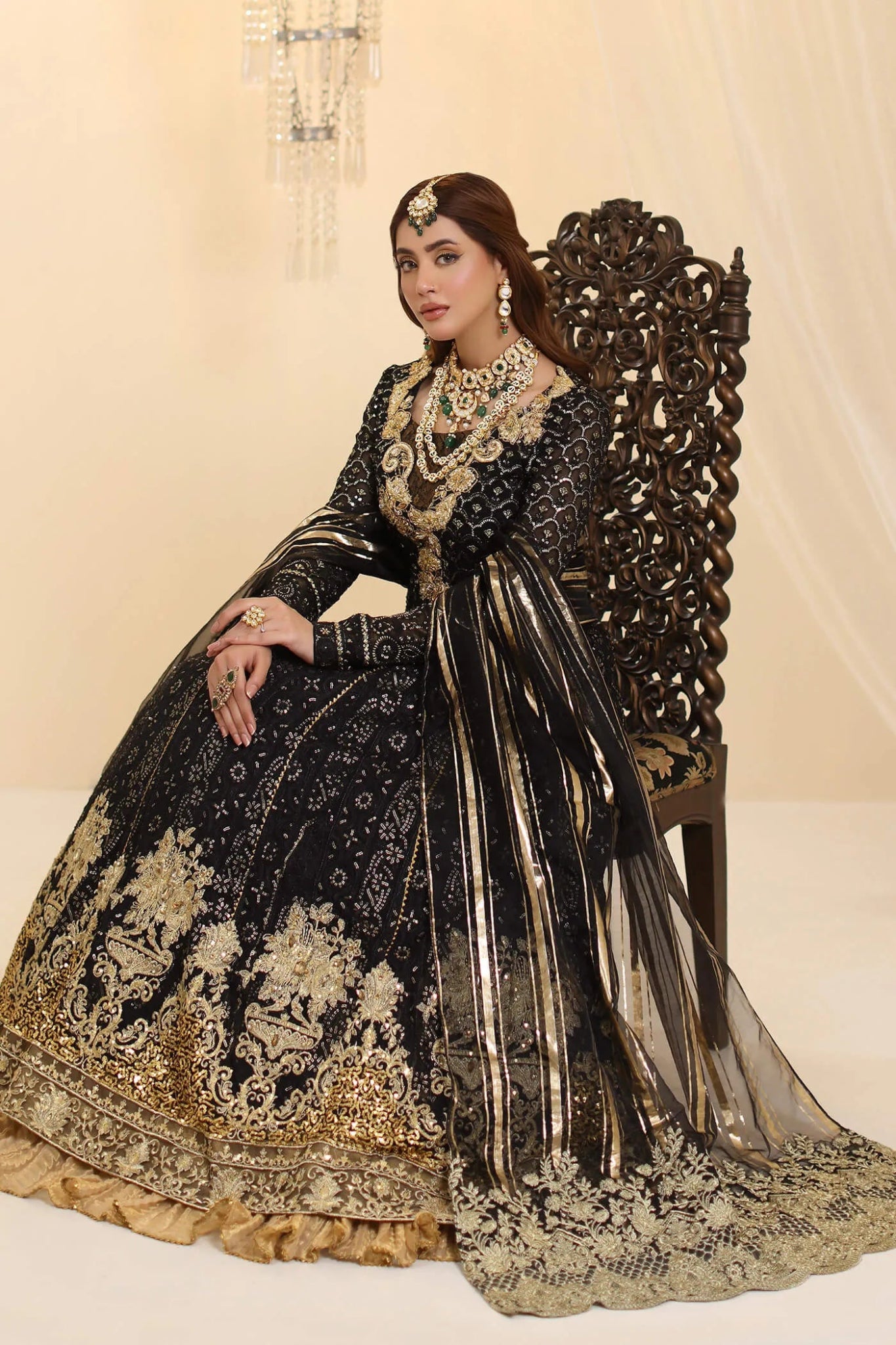 Model wearing Musferah Saad Enchantment dress in black and gold from the Ethereal Dream Formals collection, perfect for Pakistani wedding clothes online in the UK.