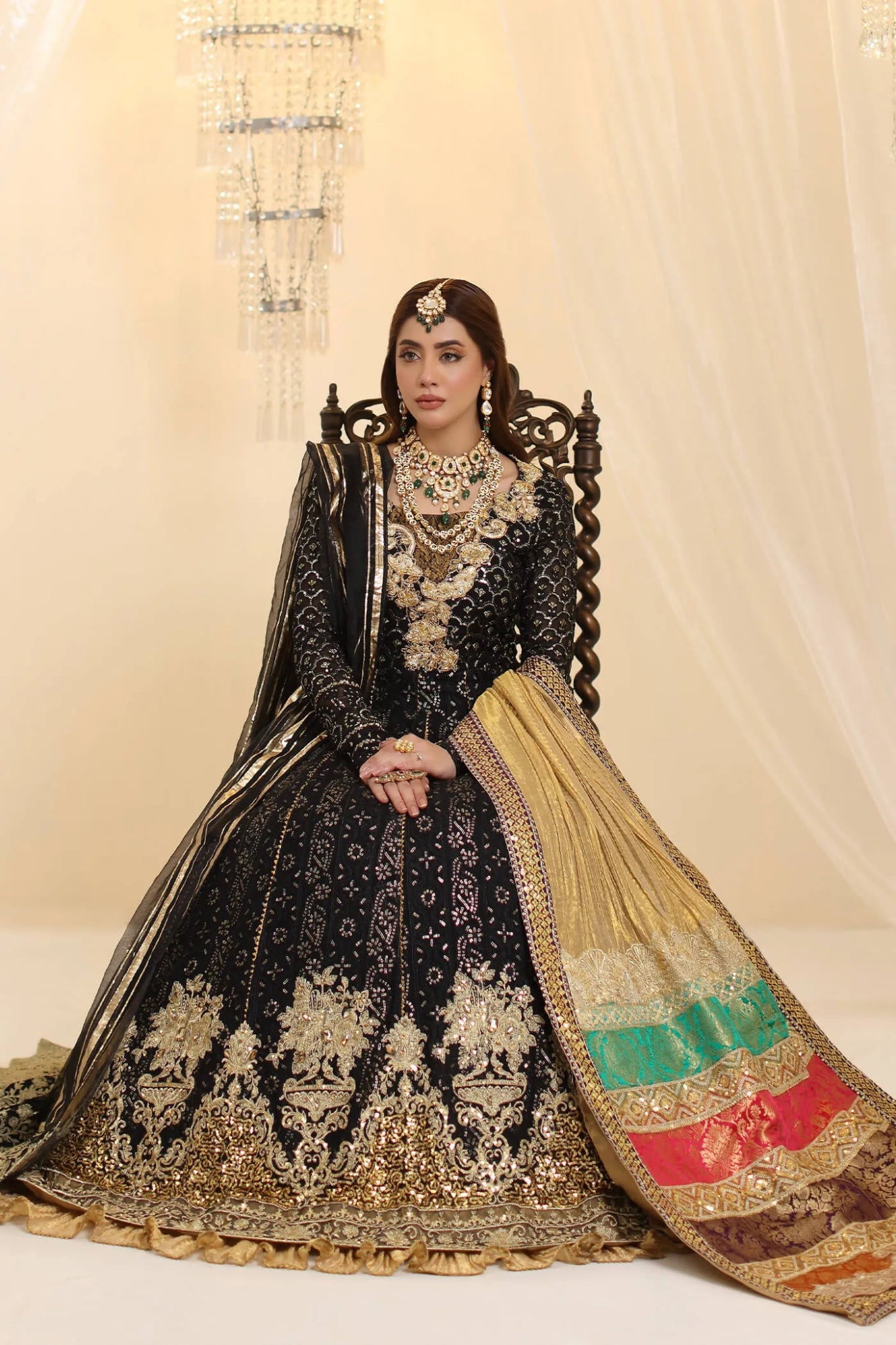 Model wearing Musferah Saad Enchantment dress in black and gold from the Ethereal Dream Formals collection, perfect for Pakistani wedding clothes online in the UK.